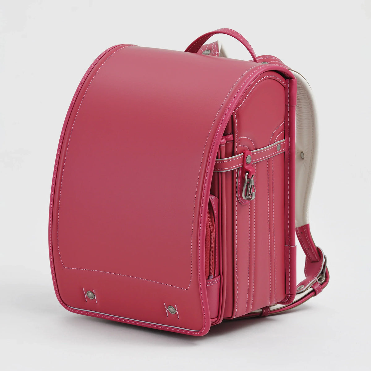 Bolca Randoseru by Murase Kabanko – pink Japanese randoseru backpack with white stitching on a plain background