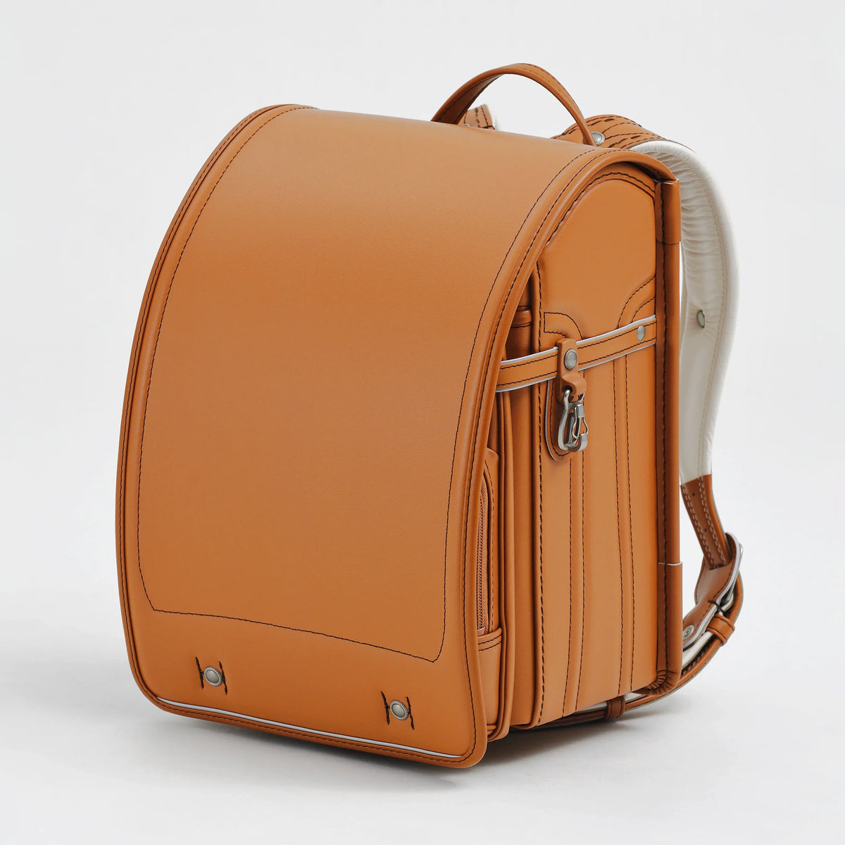 Bolca Randoseru by Murase Kabanko – classic tan Japanese Randoseru backpack with white straps on a plain background