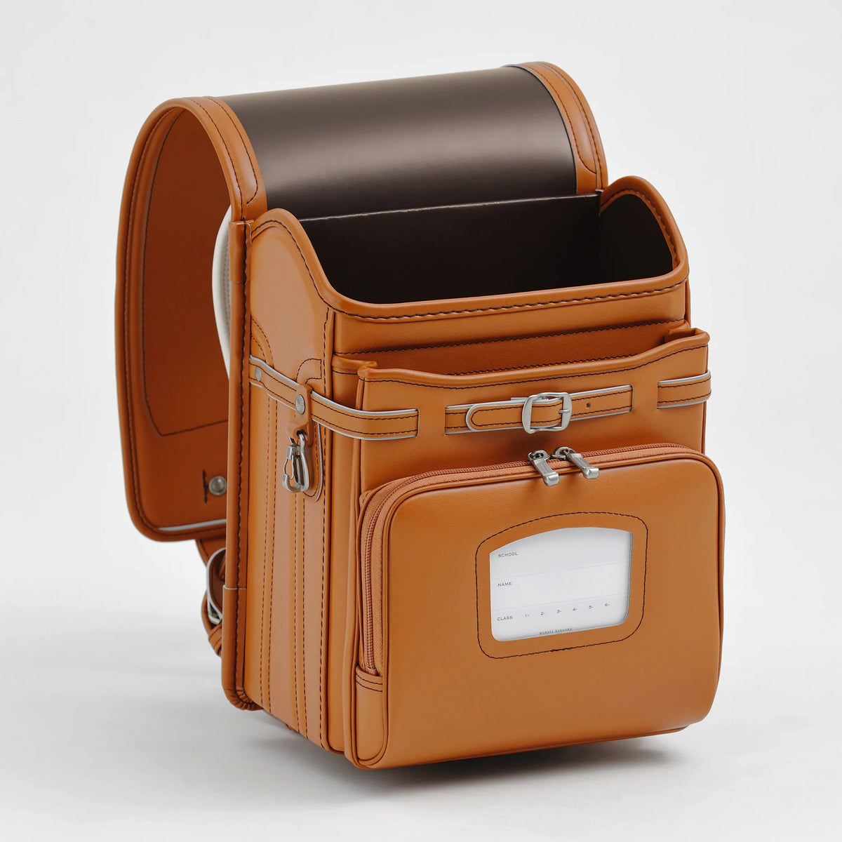 Bolca Randoseru by Murase Kabanko – tan Japanese randoseru backpack with front pocket and name tag, handcrafted leather design