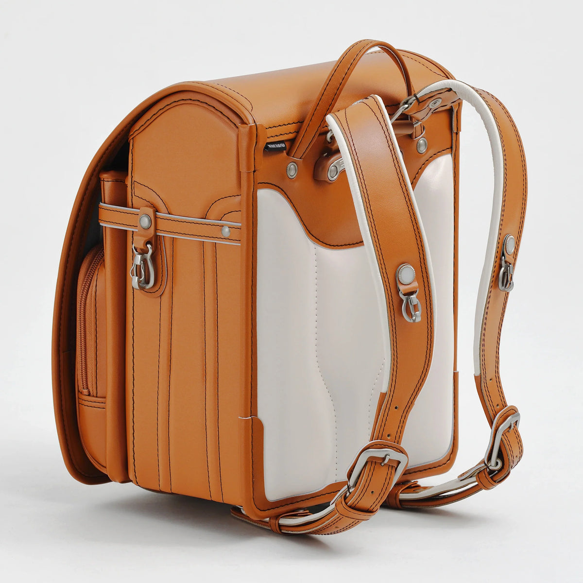 Bolca Randoseru by Murase Kabanko – tan and white Japanese randoseru backpack with adjustable straps on a white background