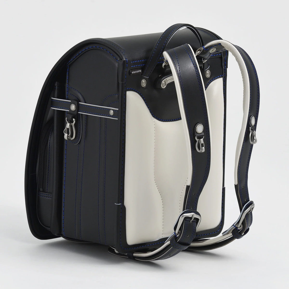 Bolca Randoseru by Murase Kabanko – black and white Japanese Randoseru backpack with blue stitching, adjustable straps