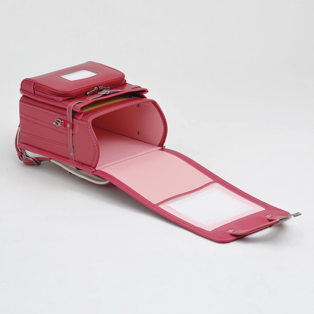 Bolca Randoseru by Murase Kabanko – pink Japanese randoseru backpack open to show spacious interior and front pocket