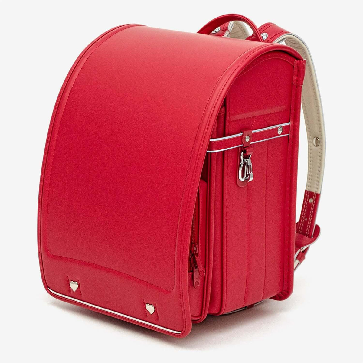 Mu+ Randoseru (Red) by Murase Kabanko – red Japanese randoseru backpack with heart accents and white stitching on a white background