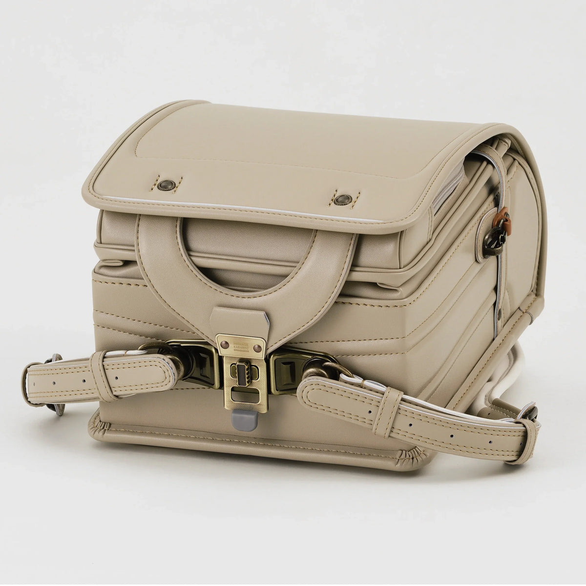 Bolca Grayish Randoseru by Murase Kabanko – beige Japanese randoseru backpack with metal clasp, shown from the front on white background