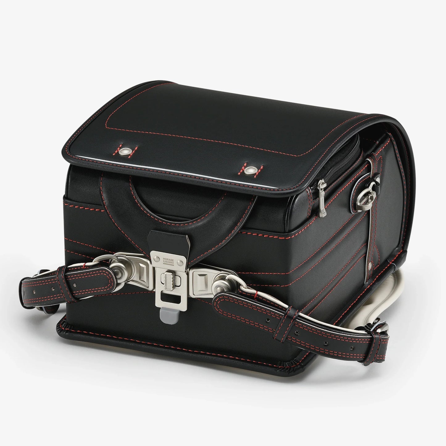 Black Japanese Randoseru backpack with red stitching and silver buckle on white background