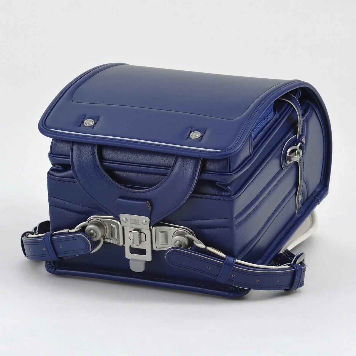 Bolca Randoseru by Murase Kabanko – blue Japanese Randoseru backpack with metal buckle, handcrafted leather, white background