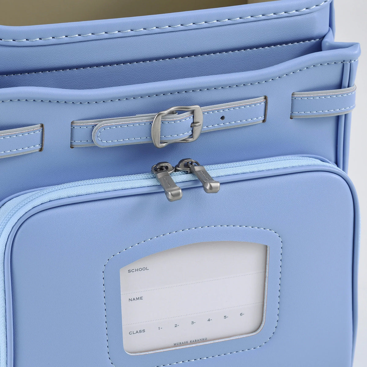 Bolca Randoseru by Murase Kabanko – light blue Japanese randoseru backpack close-up with zippered pocket and name tag window
