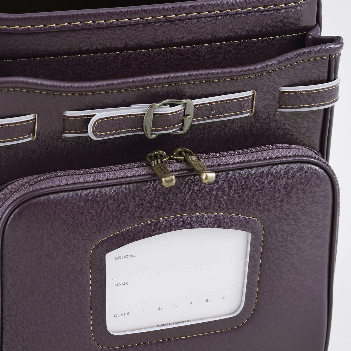 Bolca Grayish Randoseru by Murase Kabanko – close-up of a purple Japanese randoseru backpack with buckles and name tag pocket