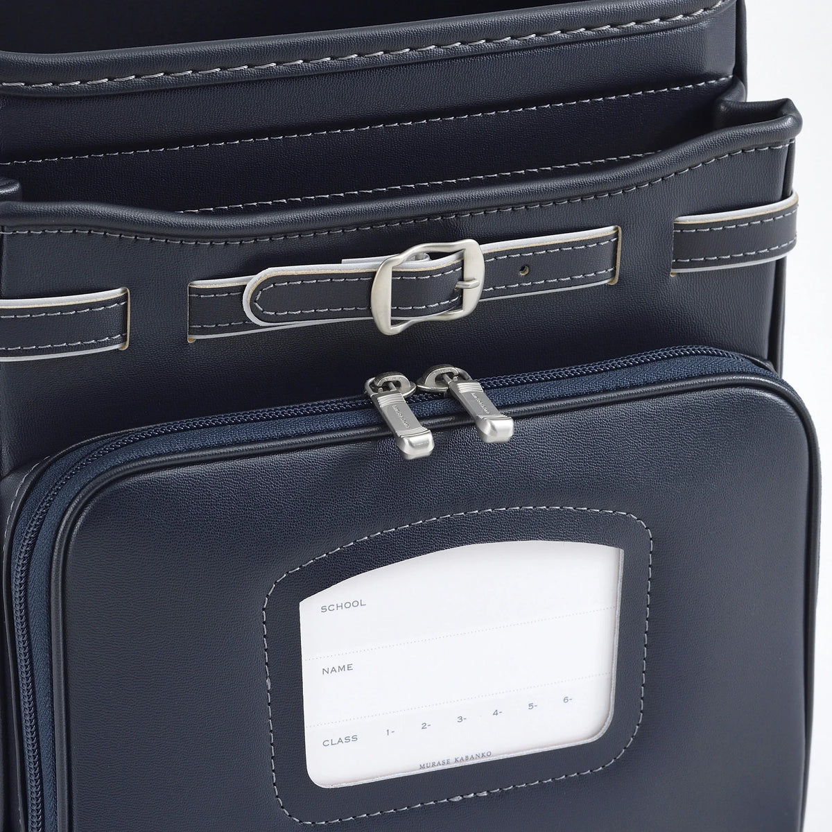 Bolca Randoseru by Murase Kabanko – close-up of authentic navy Japanese randoseru backpack showing front pocket and name tag.