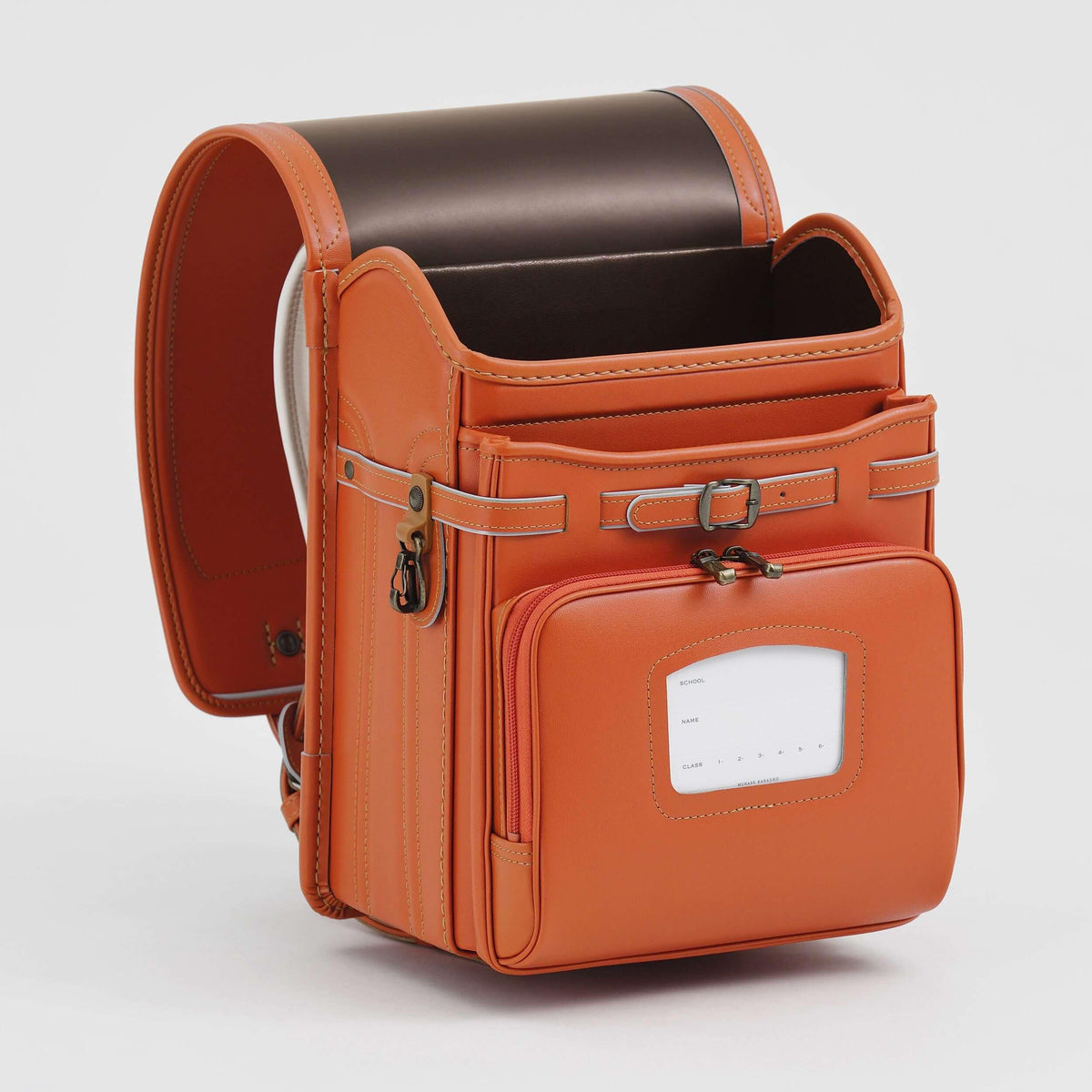 Bolca Randoseru by Murase Kabanko – orange Japanese randoseru backpack with brown interior, open and standing upright