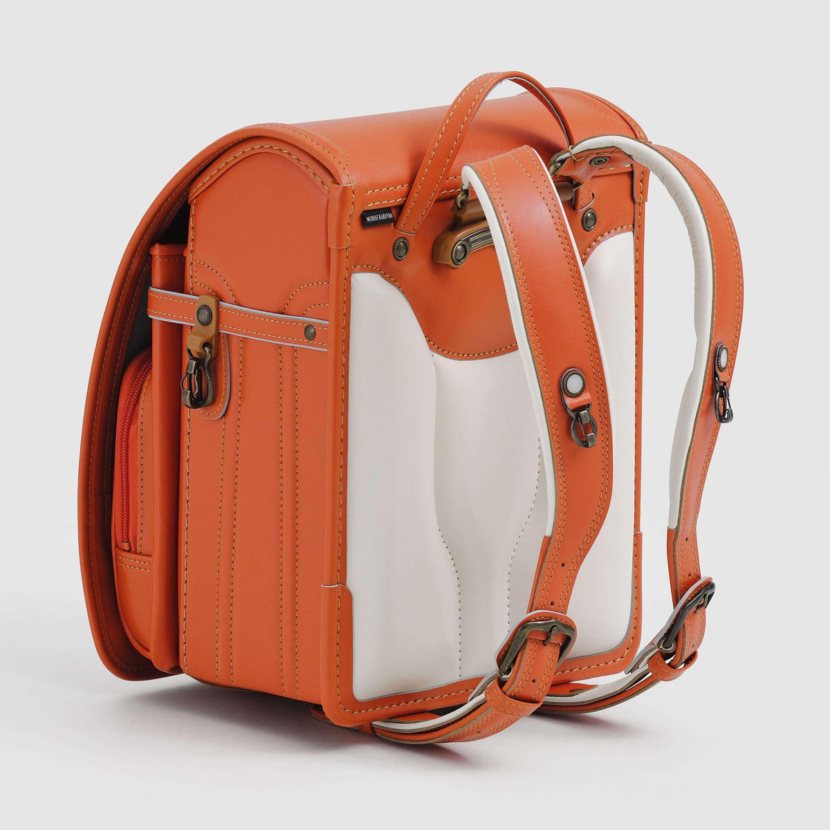 Bolca Randoseru by Murase Kabanko – orange Japanese randoseru backpack with padded white back panel and adjustable straps
