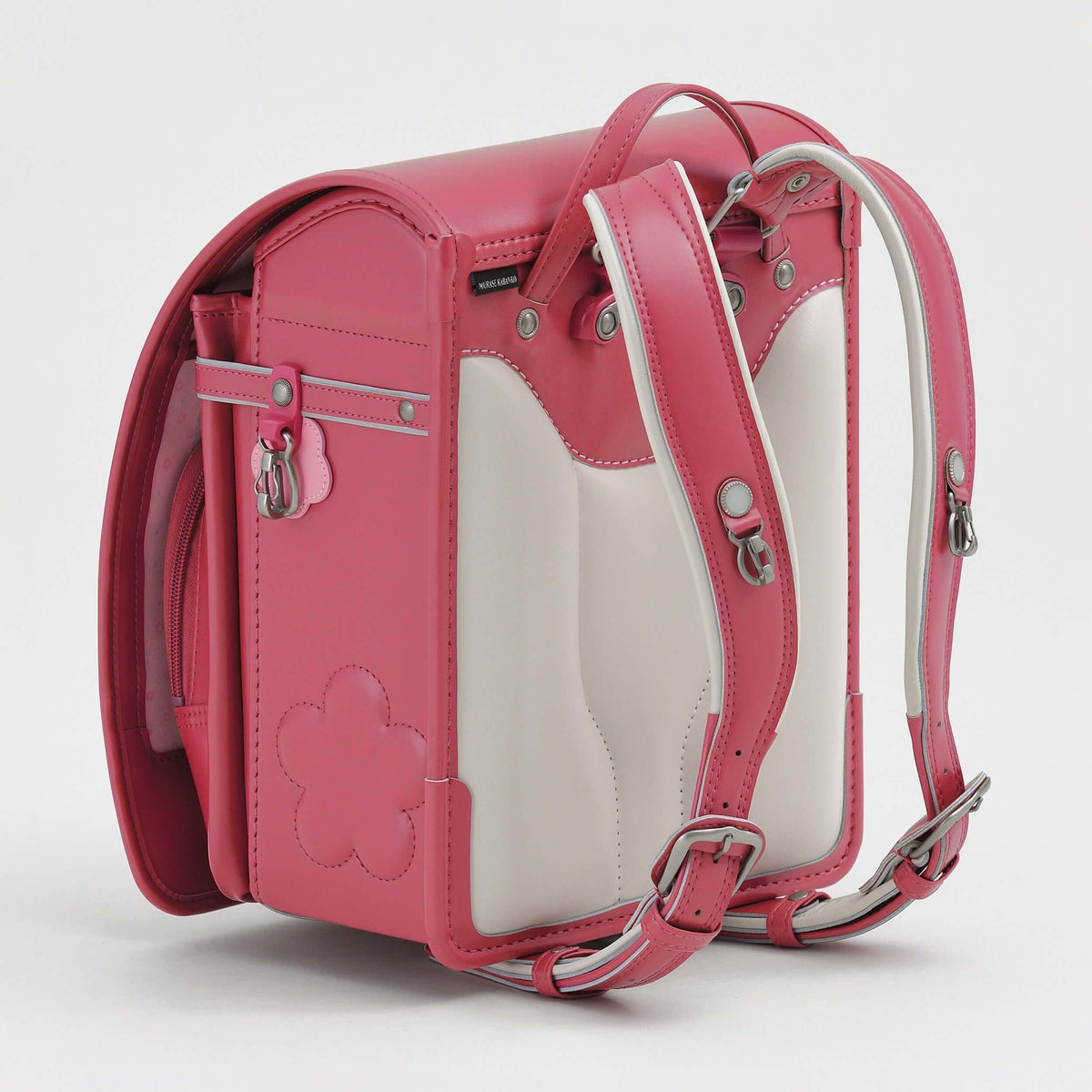 Huo Randoseru by Murase Kabanko – pink and white Japanese randoseru backpack with flower detail, leather straps, and metal buckles