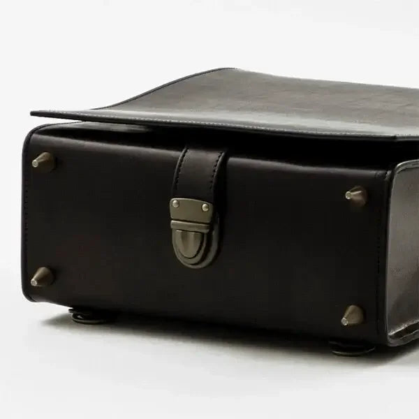 Adult Randoseru backpack (Kabuto), black premium Tochigi leather, bottom view showing metal feet and clasp