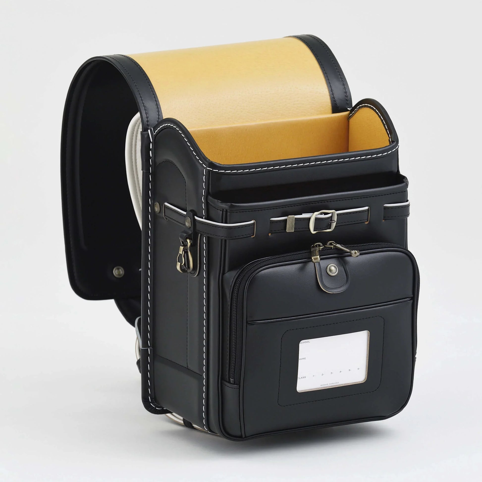 Premium Randoseru Takumi Black leather backpack with yellow interior and front pocket by Murase Kabanko
