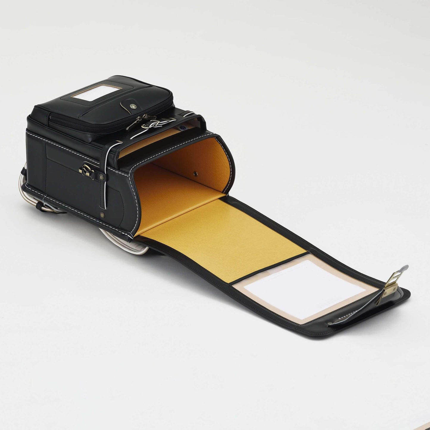 Premium Randoseru Takumi black leather backpack with yellow interior and white contrast stitching