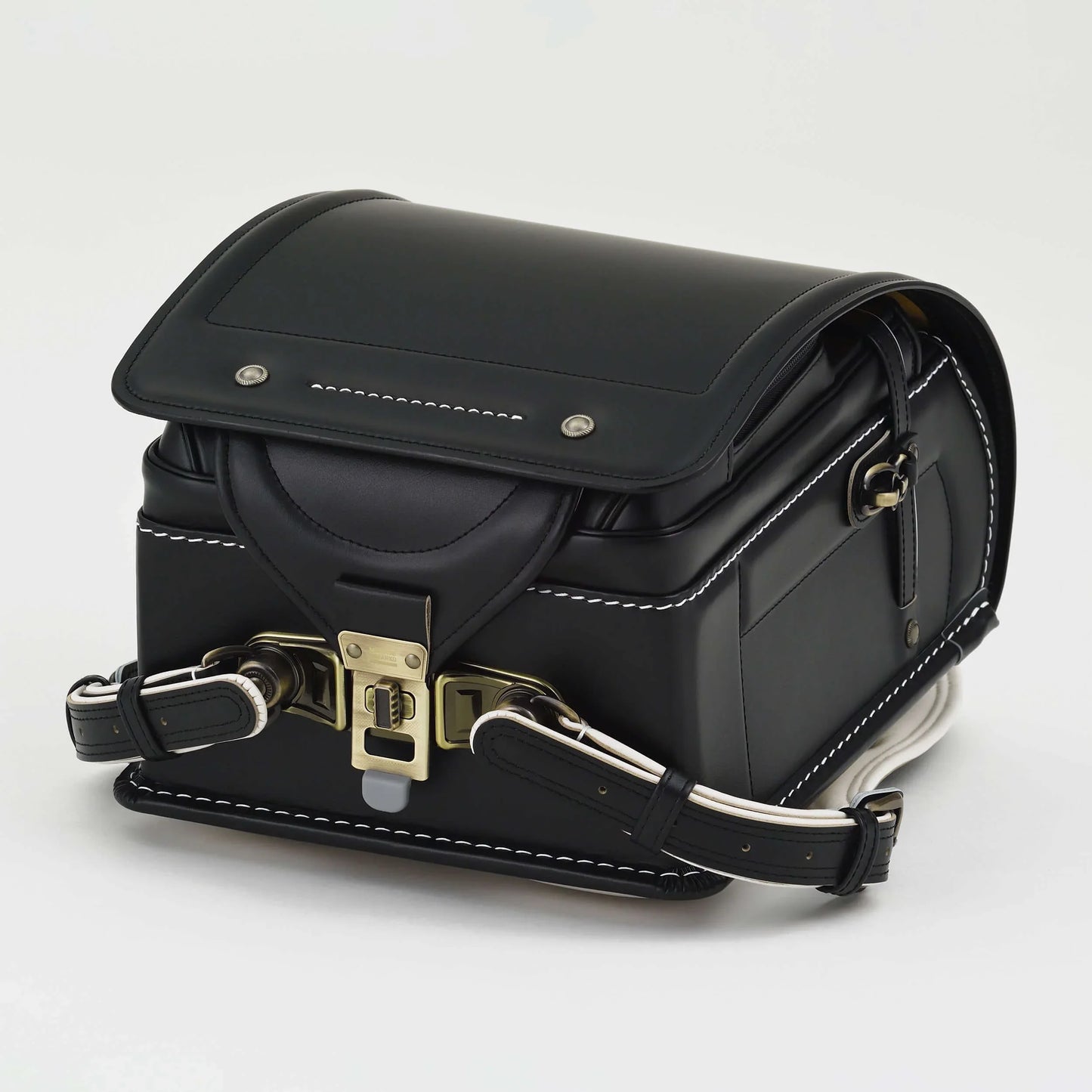 Premium Randoseru Takumi black backpack by Murase Kabanko with white stitching and brass hardware