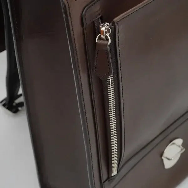 Close-up of brown Japanese Randoseru school backpack with zipper and metal clasp