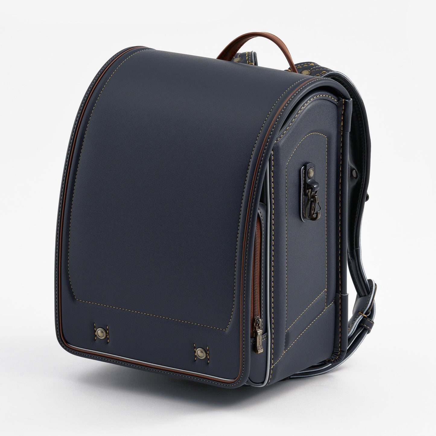 Navy blue Japanese randoseru backpack with brown accents on a white background