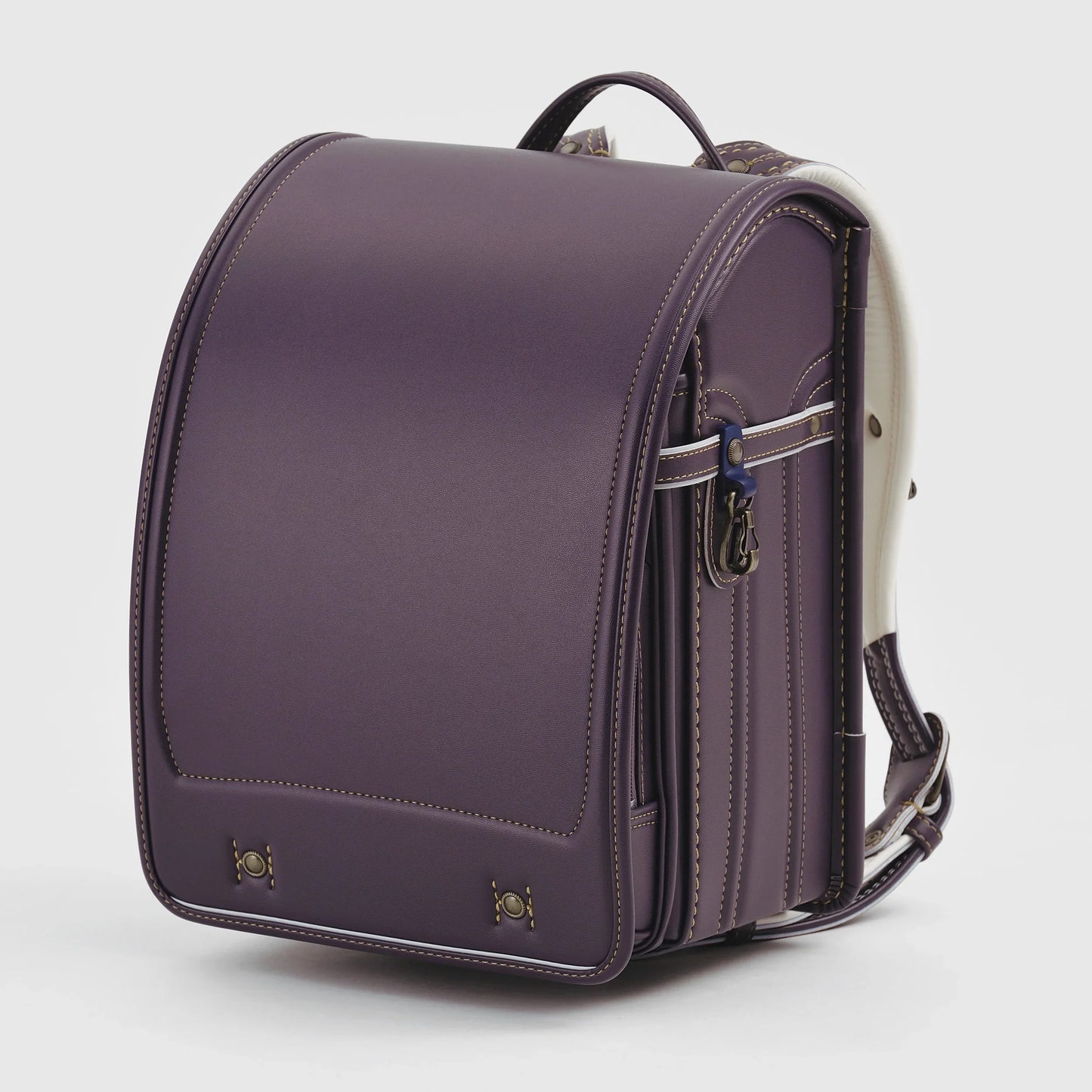 Purple Japanese randoseru backpack with white trim on white background