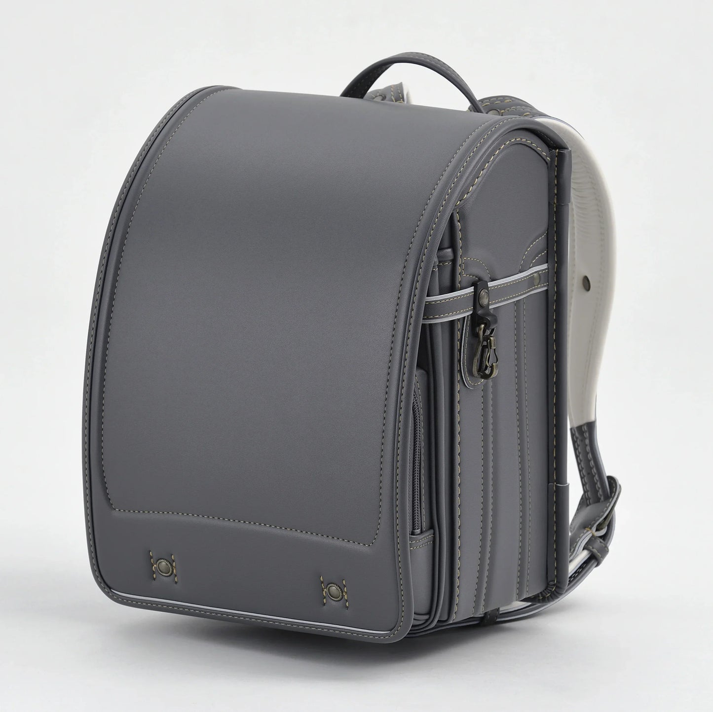 Gray Japanese Randoseru backpack with structured design and leather stitching detail