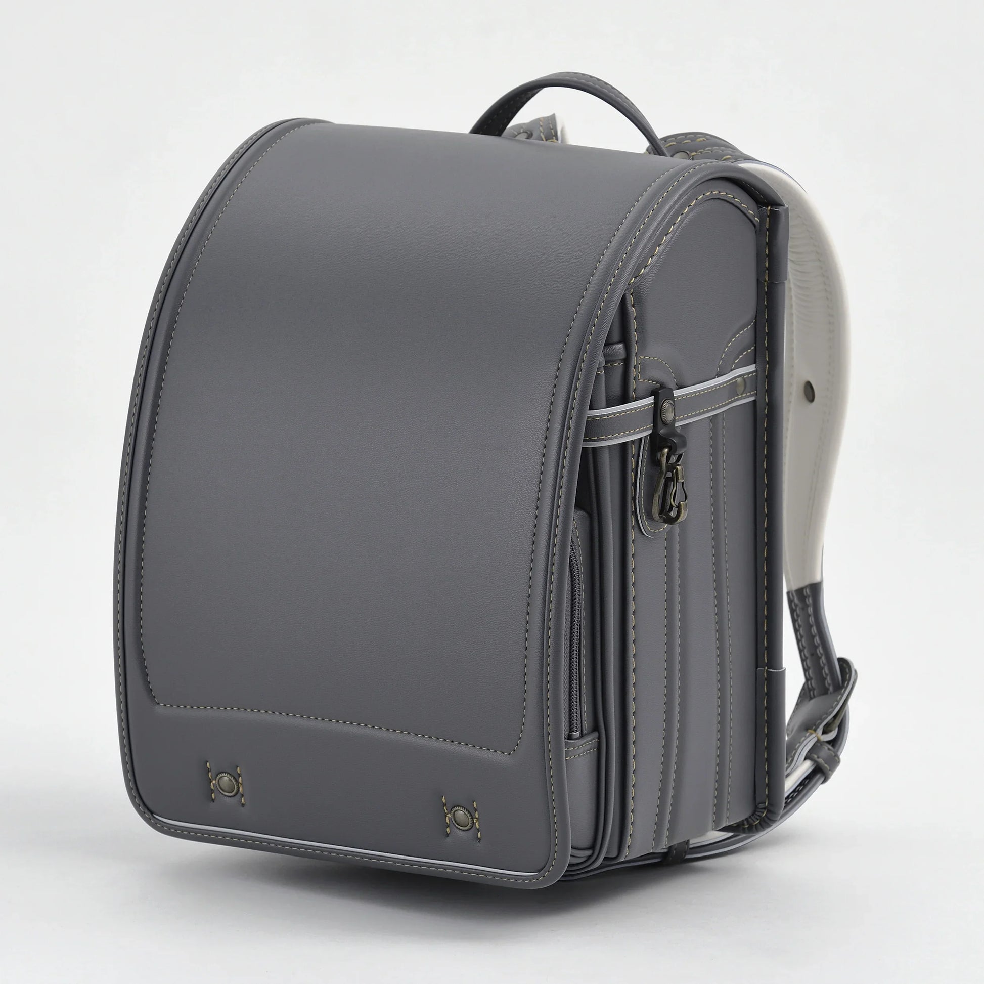 Gray Japanese Randoseru backpack with structured design and leather stitching detail