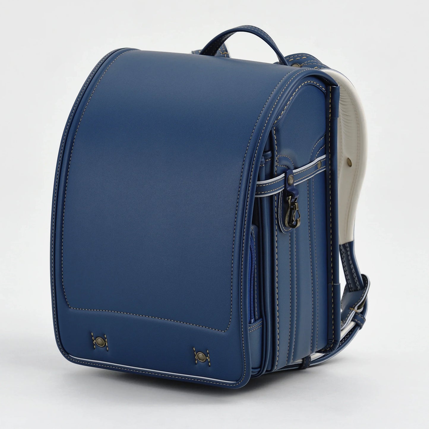 Japanese blue randoseru backpack with white interior, sturdy stitching, and classic design