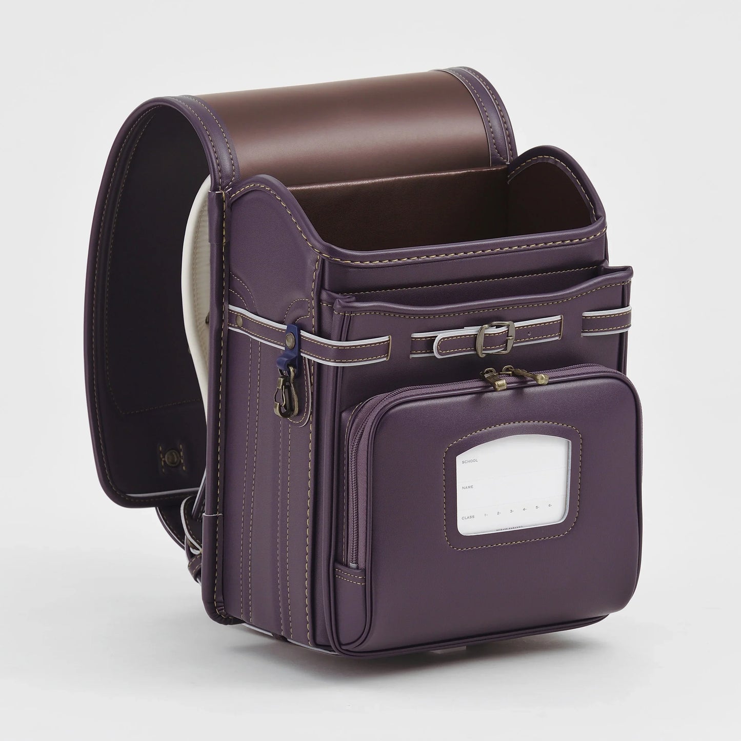 Purple Japanese Randoseru backpack with white stitching and front pocket on white background