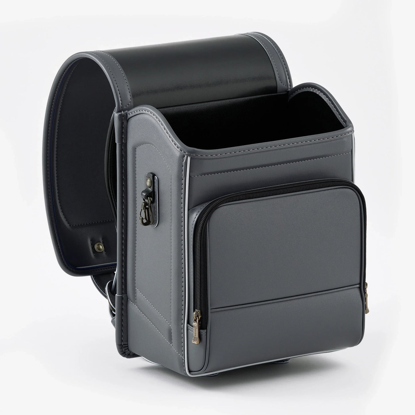 Gray Japanese Randoseru backpack with boxy shape and front zipper pocket on white background.