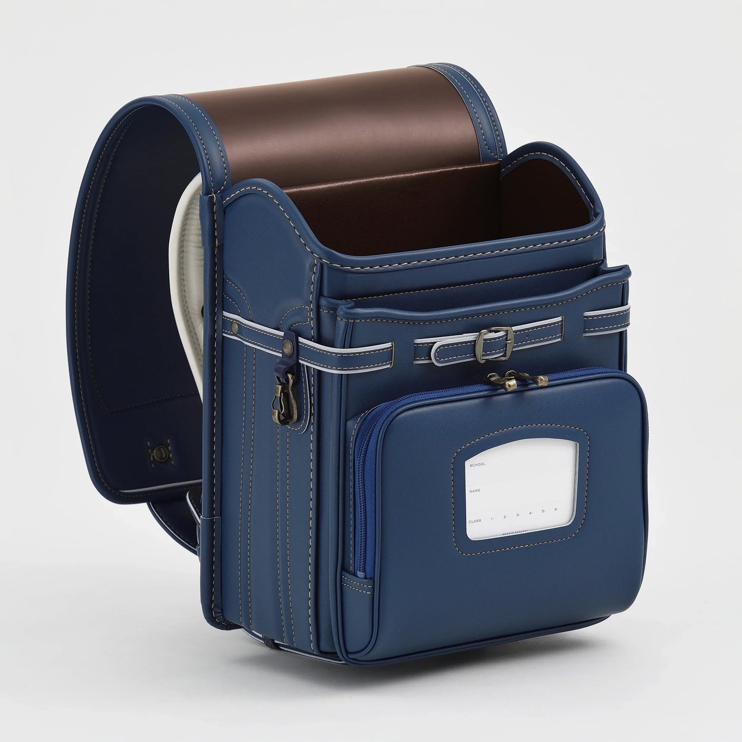 Blue Japanese randoseru backpack with brown interior and white stitching, open and empty