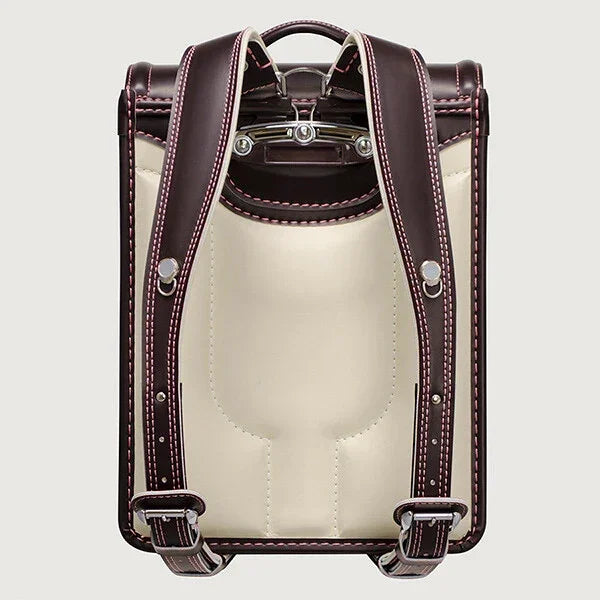 Back view of a Japanese randoseru backpack with brown straps and cream padding