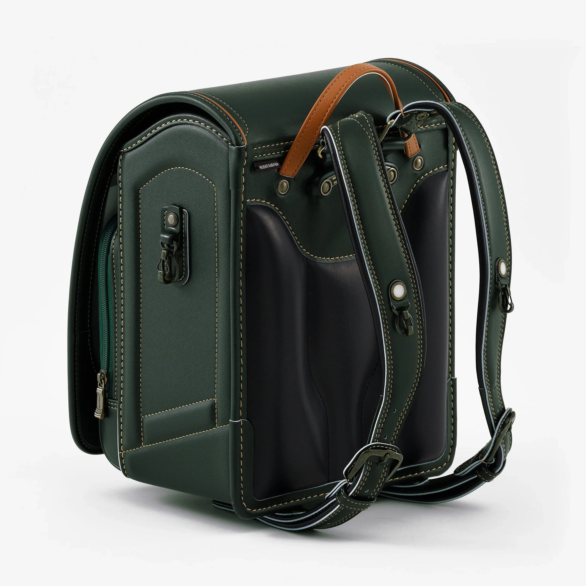 Green Japanese randoseru backpack with brown handle and detailed stitching, rear view