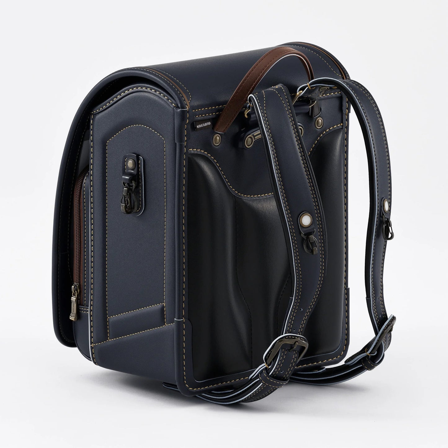 Japanese randoseru backpack in navy with brown accents and adjustable straps