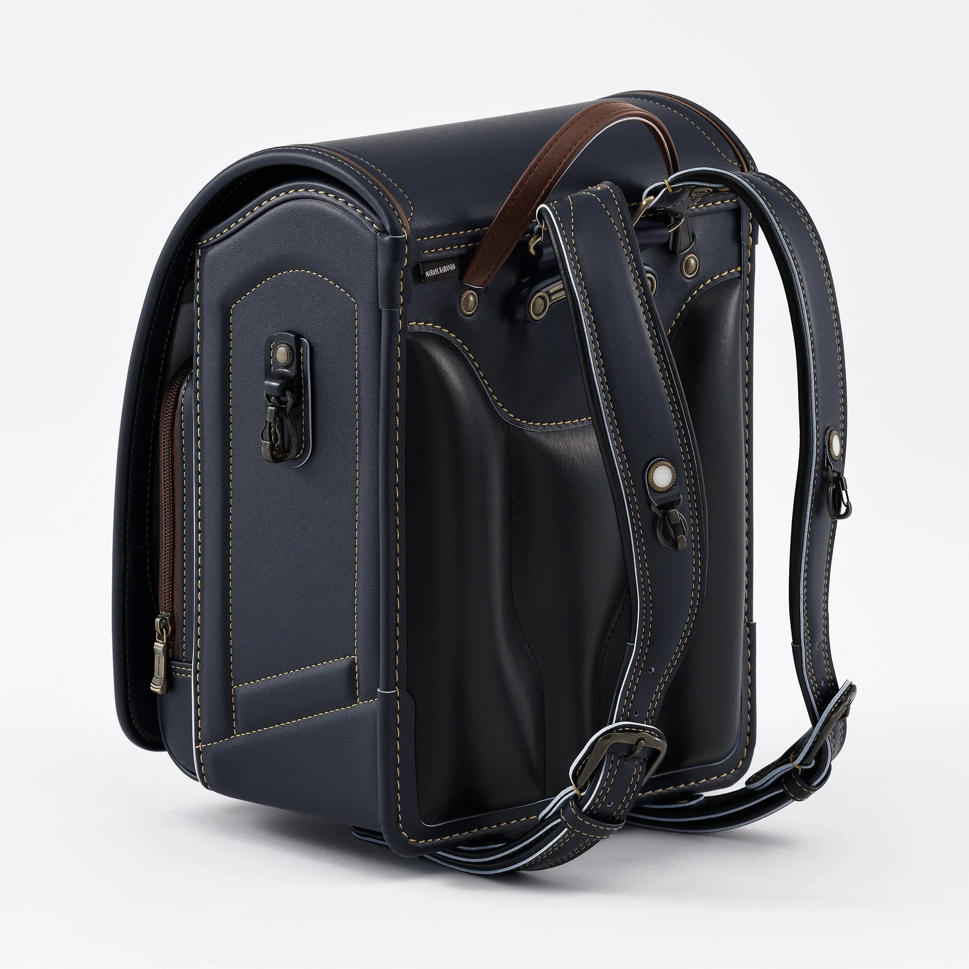 Japanese randoseru backpack in navy with brown accents and adjustable straps