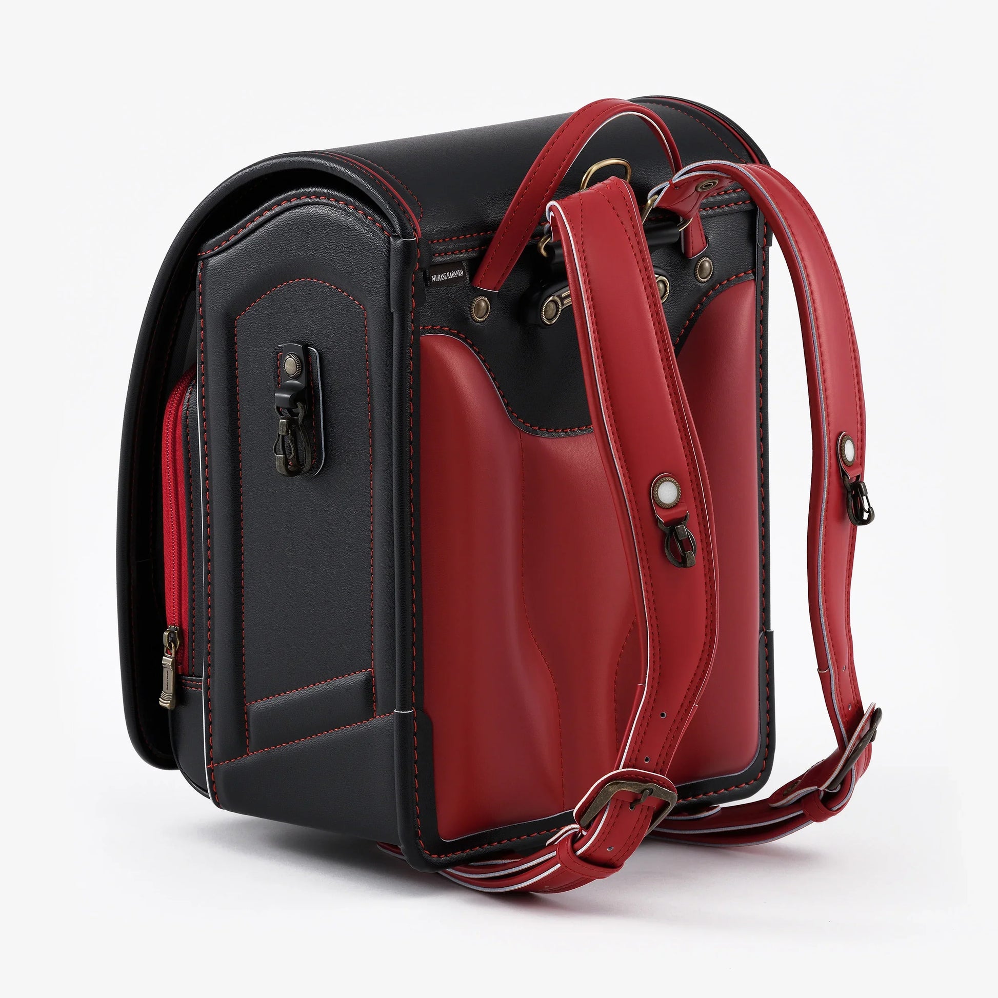 Japanese randoseru backpack in black and red leather with adjustable straps, rear view