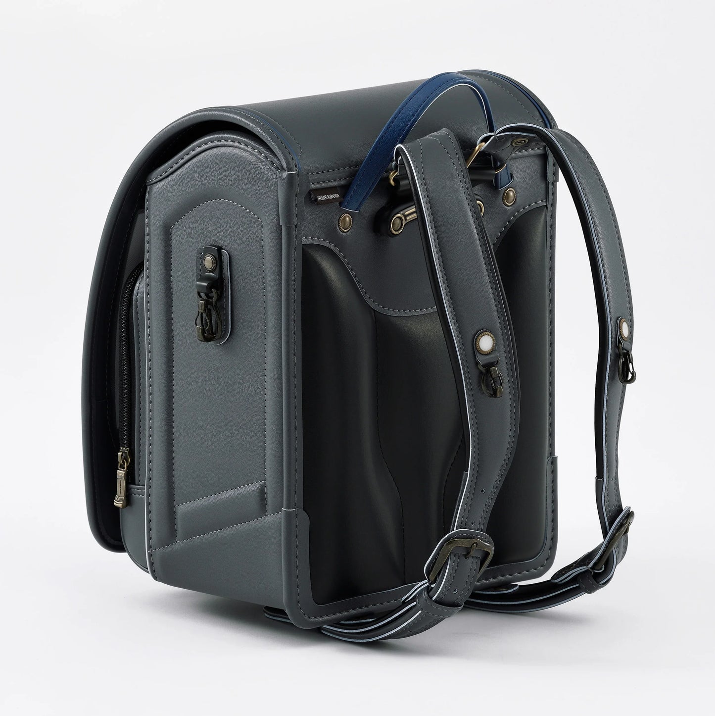 Gray Japanese randoseru backpack with blue handle, detailed stitching, and adjustable straps