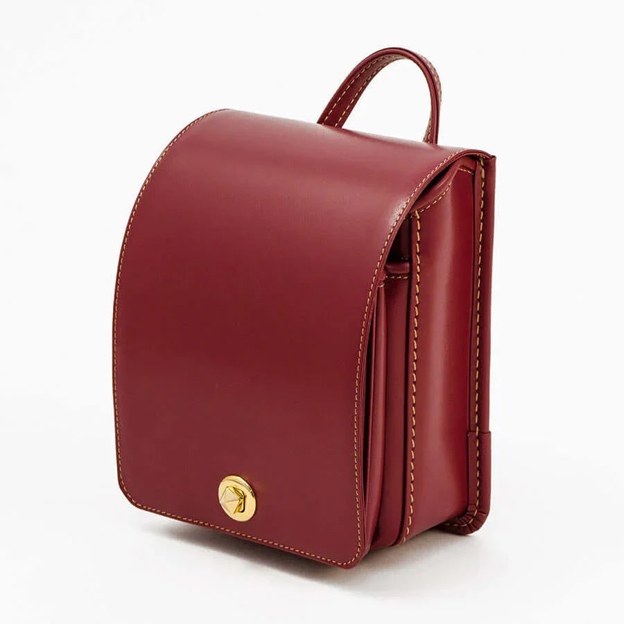 Murase Kabanko mini randoseru backpack in burgundy with gold clasp