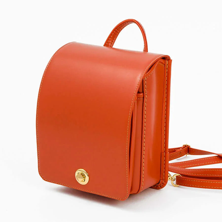 Murase Kabanko mini randoseru backpack in orange leather with gold clasp