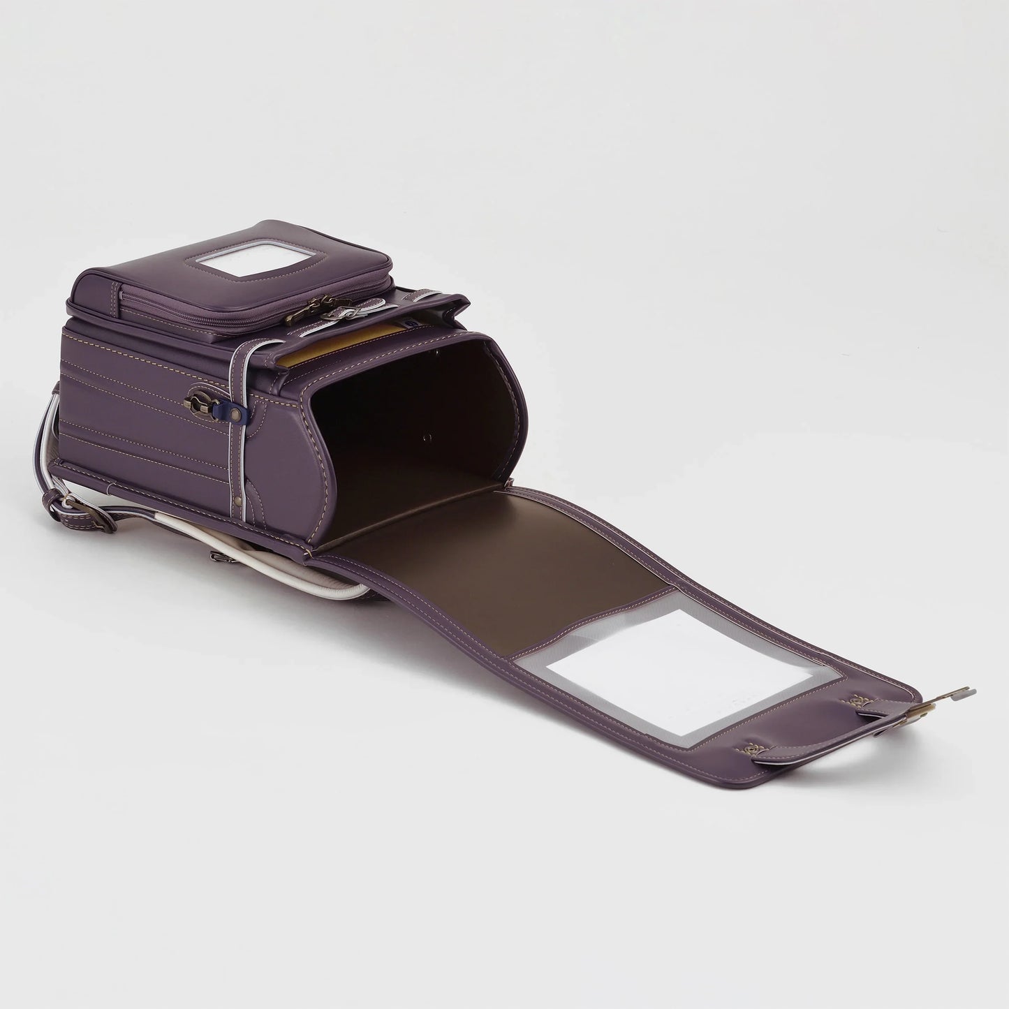 Purple Japanese Randoseru backpack open to show spacious interior and sturdy construction