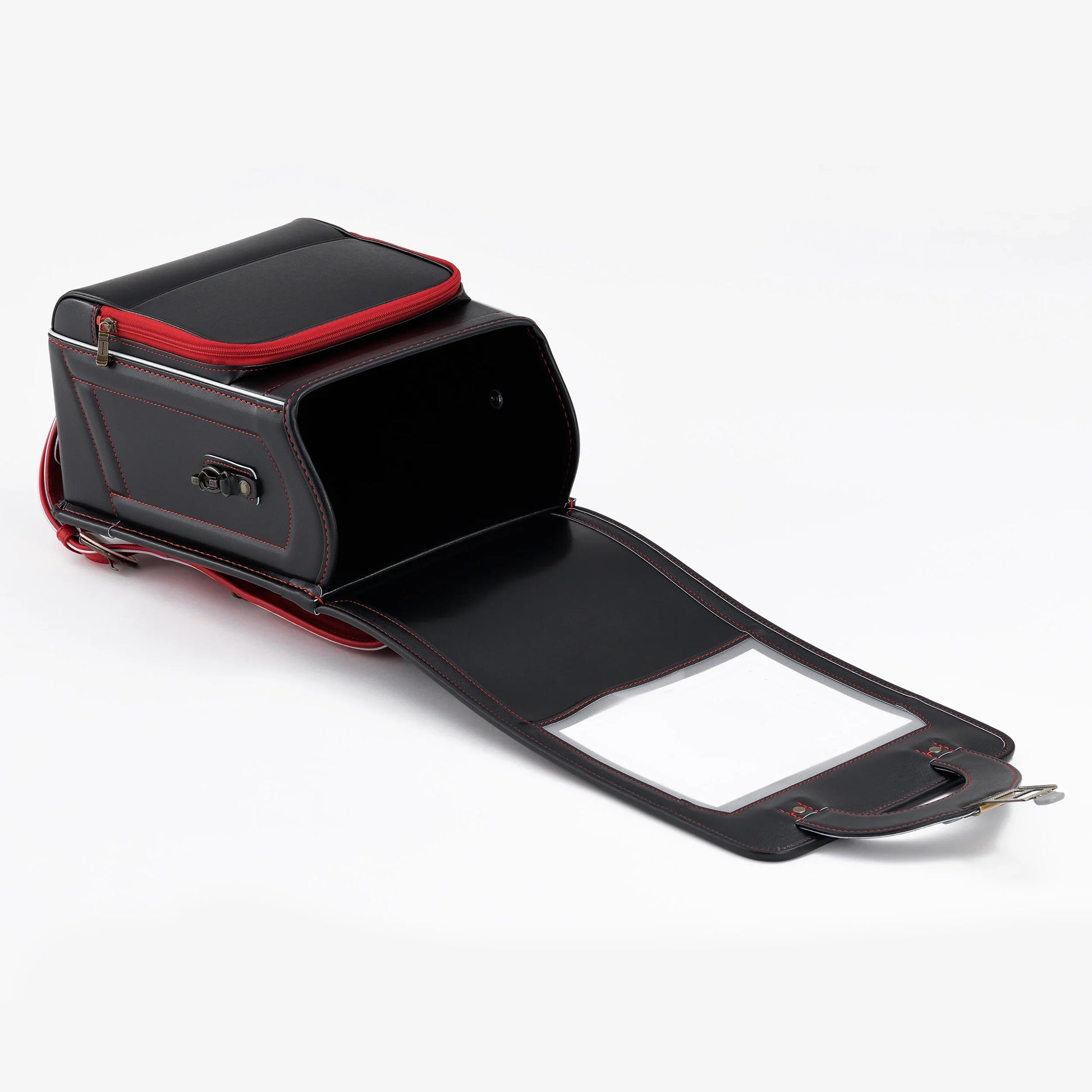 Black Japanese Randoseru backpack with red accents, open to show spacious interior