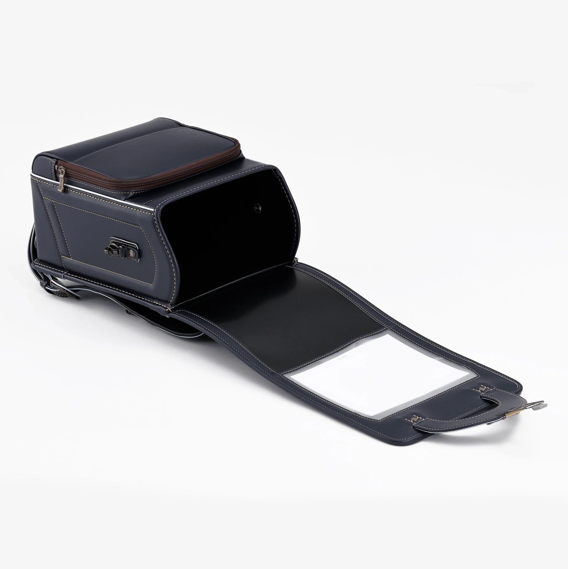 Open Japanese randoseru backpack in navy leather with visible stitching on white background