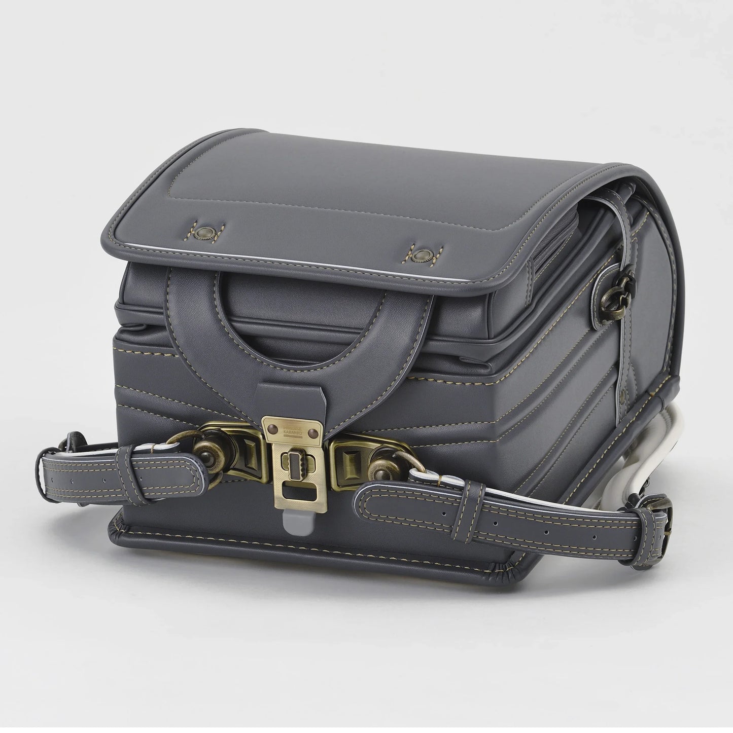 Dark gray Japanese Randoseru backpack with brass hardware and detailed stitching