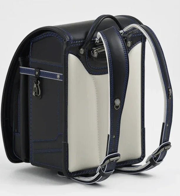 Randoseru backpack, black with white side panels, blue stitching, and metal buckles, Murase Kabanko (村瀬鞄行)