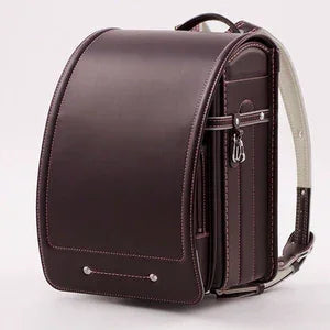 Randoseru backpack in chocolate brown with white stitching, Japanese school bag.